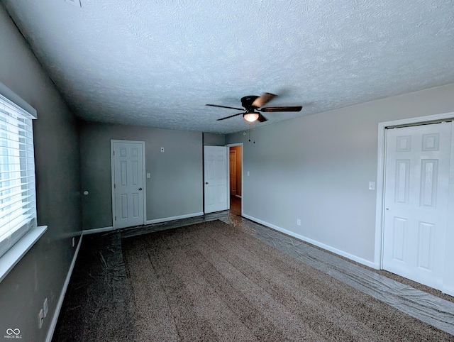 301 W Davis St, Greensburg, IN 47240 - carpeted empty room featuring ceiling fan, baseboards, and a textured ceiling