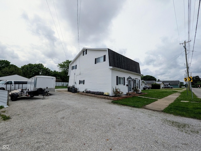 301 W Davis St, Greensburg, IN 47240 - view of home's exterior with a shingled roof, driveway, and a gambrel roof
