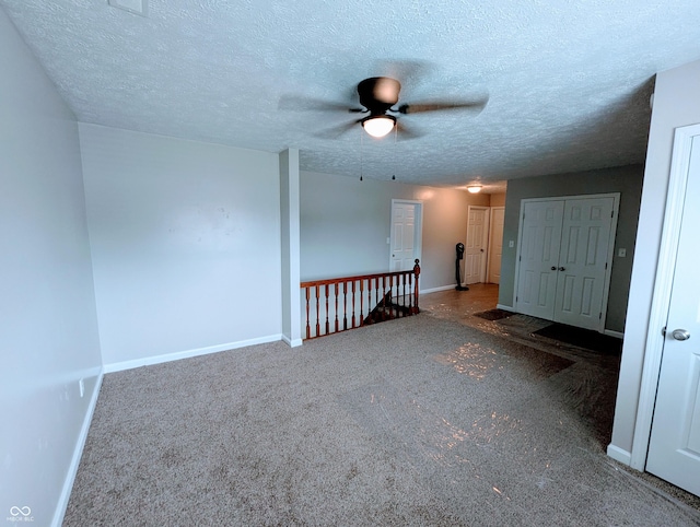 301 W Davis St, Greensburg, IN 47240 - unfurnished room with a ceiling fan, baseboards, carpet floors, and a textured ceiling