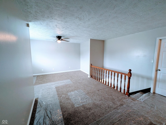 301 W Davis St, Greensburg, IN 47240 - unfurnished room featuring ceiling fan, baseboards, carpet flooring, and a textured ceiling