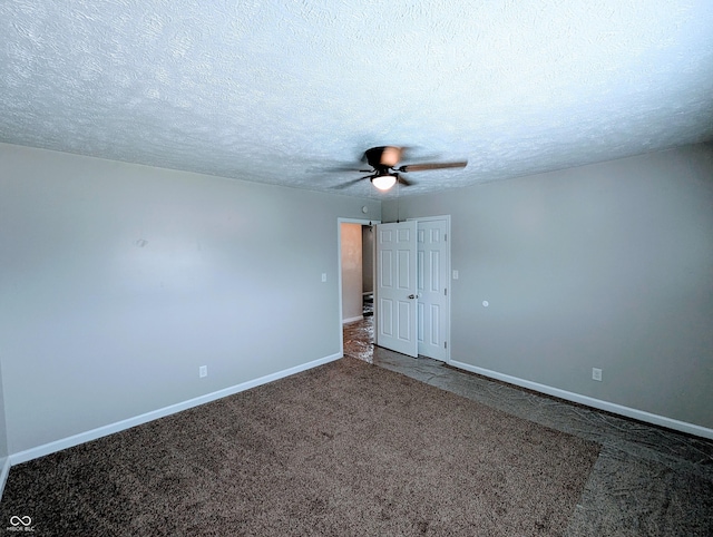 301 W Davis St, Greensburg, IN 47240 - carpeted spare room featuring a ceiling fan, baseboards, and a textured ceiling