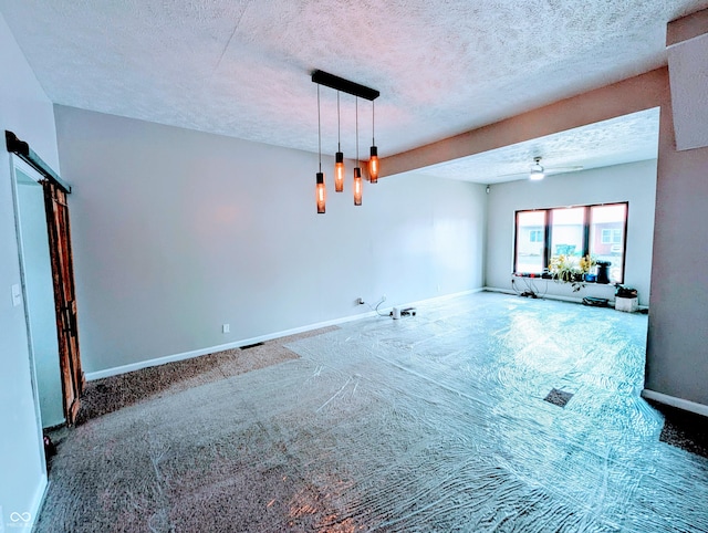 301 W Davis St, Greensburg, IN 47240 - carpeted empty room featuring a textured ceiling, baseboards, and a ceiling fan