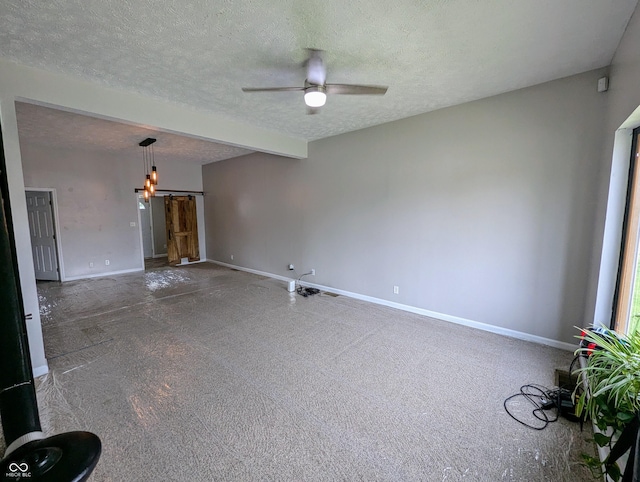 301 W Davis St, Greensburg, IN 47240 - carpeted spare room featuring baseboards, ceiling fan, a textured ceiling, and a chandelier