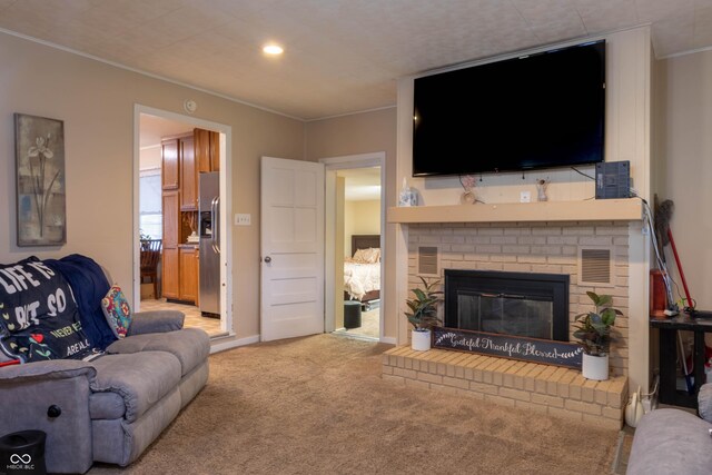 2620 13th St, Columbus, IN 47201 - living area featuring ornamental molding, carpet, a fireplace, and recessed lighting