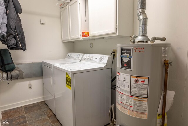 2620 13th St, Columbus, IN 47201 - laundry area featuring gas water heater, washer and dryer, cabinet space, and baseboards