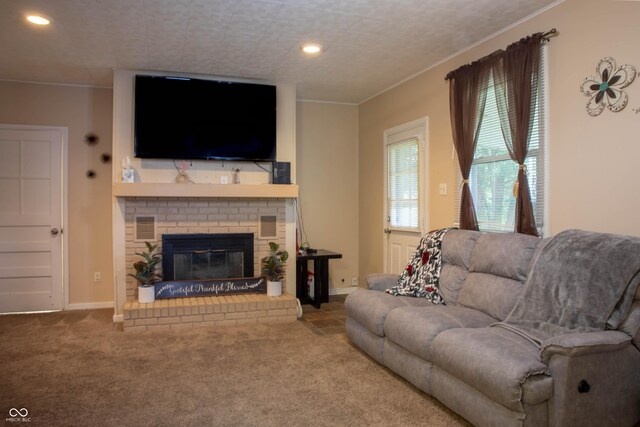 2620 13th St, Columbus, IN 47201 - carpeted living area with ornamental molding, a fireplace, recessed lighting, and baseboards