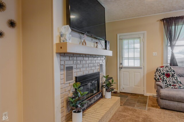 2620 13th St, Columbus, IN 47201 - living room featuring a fireplace and baseboards
