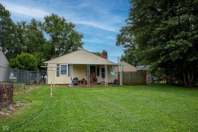 2620 13th St, Columbus, IN 47201 - rear view of house featuring a patio area and a chimney