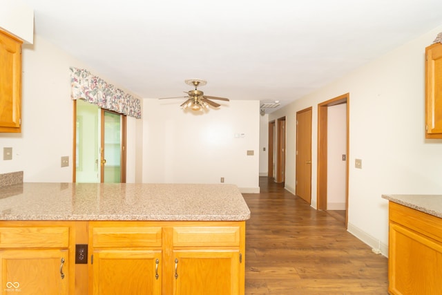 391 W 500 S, Anderson, IN 46013 - kitchen with a peninsula, a ceiling fan, wood finished floors, and light stone countertops