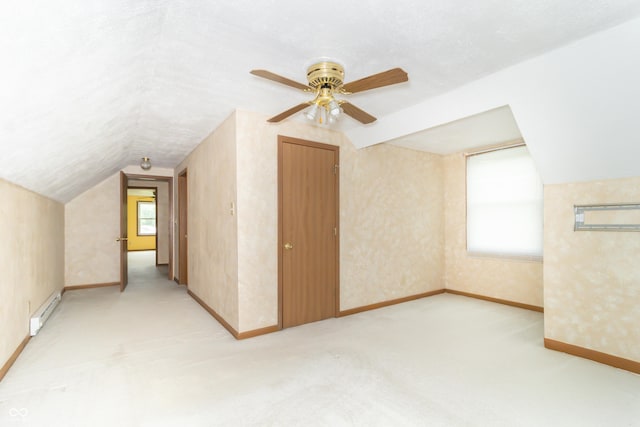 391 W 500 S, Anderson, IN 46013 - additional living space with baseboard heating, lofted ceiling, ceiling fan, and light colored carpet