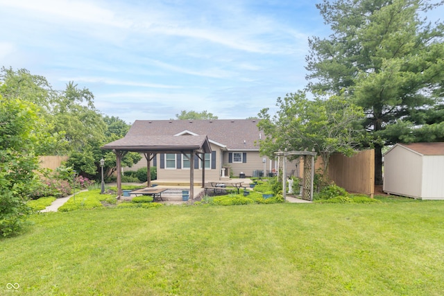 391 W 500 S, Anderson, IN 46013 - back of property featuring a patio area, a gazebo, a storage unit, roof with shingles, and a pergola