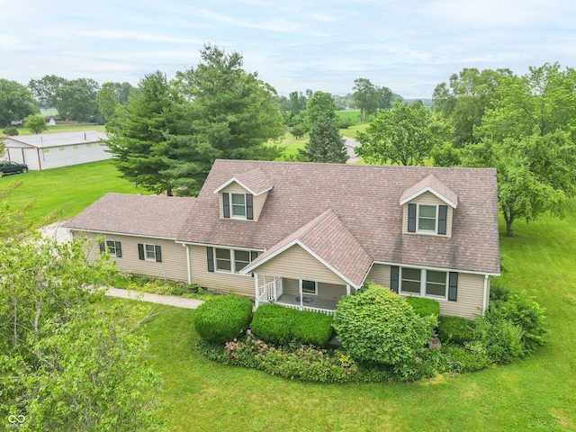 391 W 500 S, Anderson, IN 46013 - cape cod-style house with a front lawn, a shingled roof, and view of wooded area