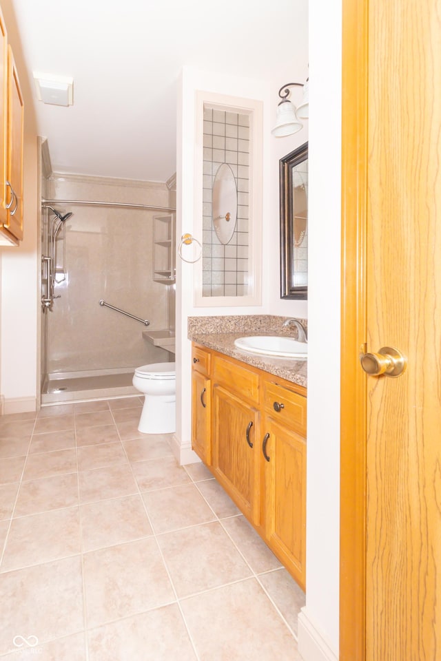 391 W 500 S, Anderson, IN 46013 - bathroom featuring vanity, an enclosed shower, and tile patterned flooring