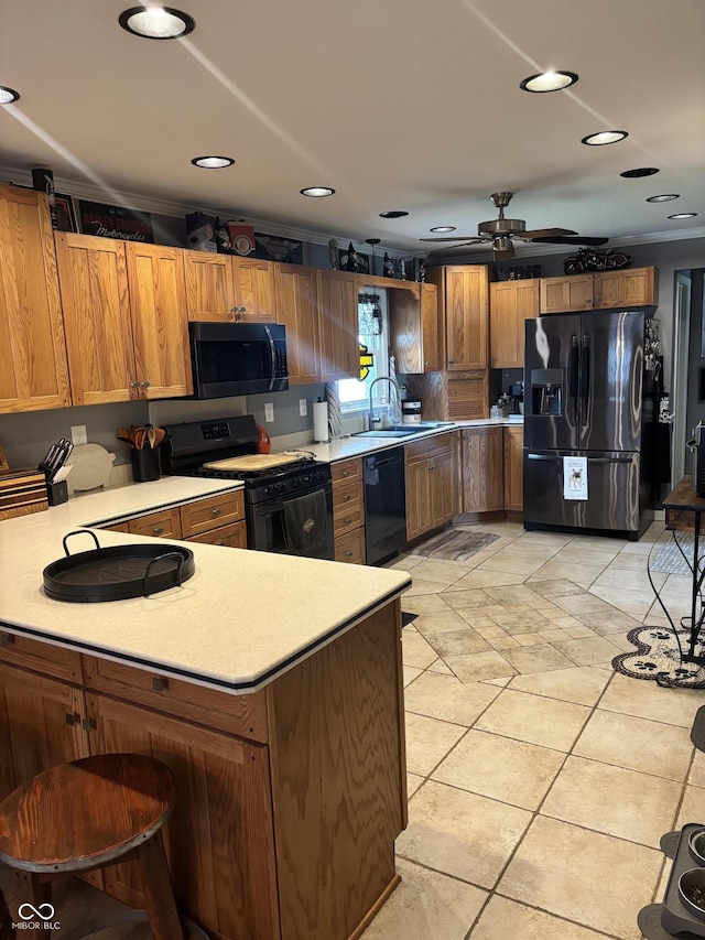 2907 Jay Dee Ln, Greenwood, IN 46143 - kitchen with black appliances, light countertops, a sink, a peninsula, and brown cabinets