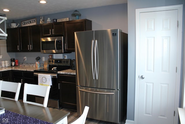 12901 N Collett Way, Camby, IN 46113 - kitchen with appliances with stainless steel finishes, recessed lighting, and light stone countertops