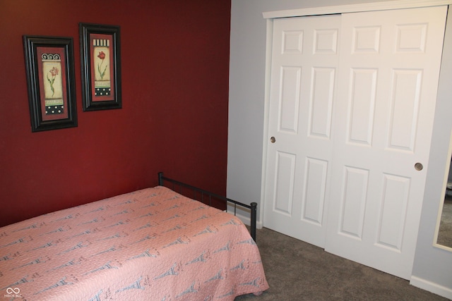 12901 N Collett Way, Camby, IN 46113 - bedroom with dark colored carpet, a closet, and baseboards