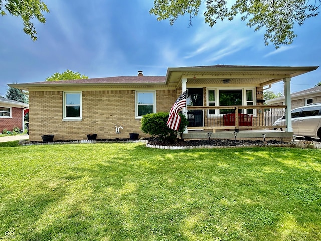 419 N 14th Ave, Beech Grove, IN 46107 - view of front of property with brick siding and a front lawn