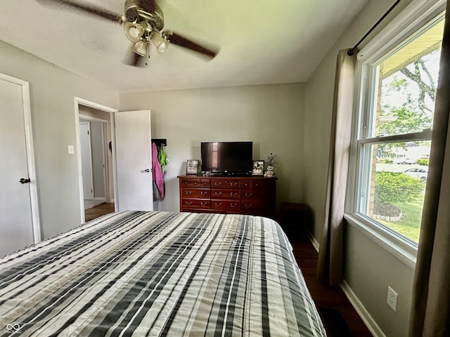 419 N 14th Ave, Beech Grove, IN 46107 - bedroom featuring multiple windows, wood finished floors, and ceiling fan