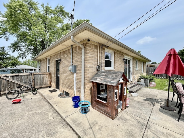 419 N 14th Ave, Beech Grove, IN 46107 - view of side of home featuring a patio area and brick siding
