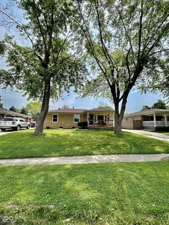 419 N 14th Ave, Beech Grove, IN 46107 - ranch-style home featuring a front yard and brick siding