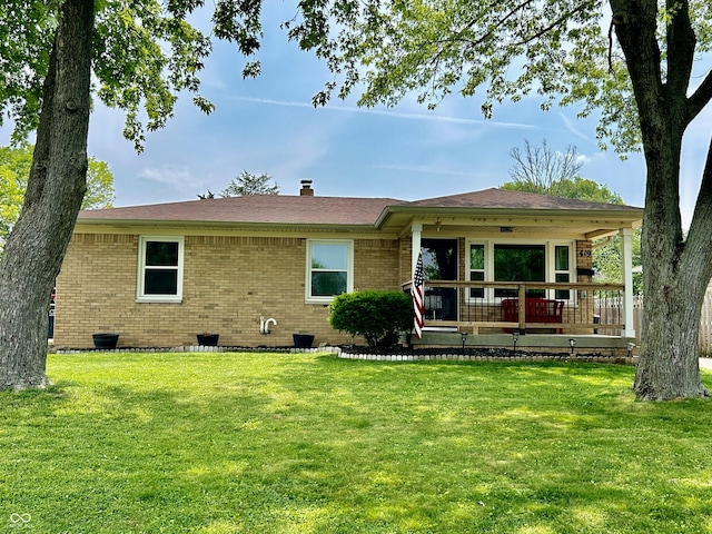 419 N 14th Ave, Beech Grove, IN 46107 - rear view of property featuring a yard, brick siding, and a chimney