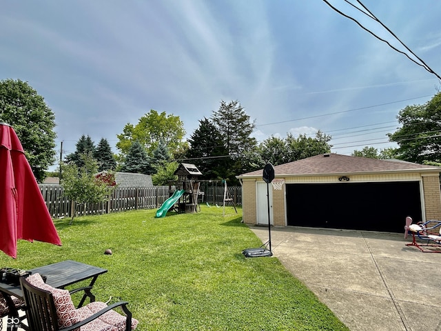 419 N 14th Ave, Beech Grove, IN 46107 - view of yard featuring a playground, an outdoor structure, and a detached garage