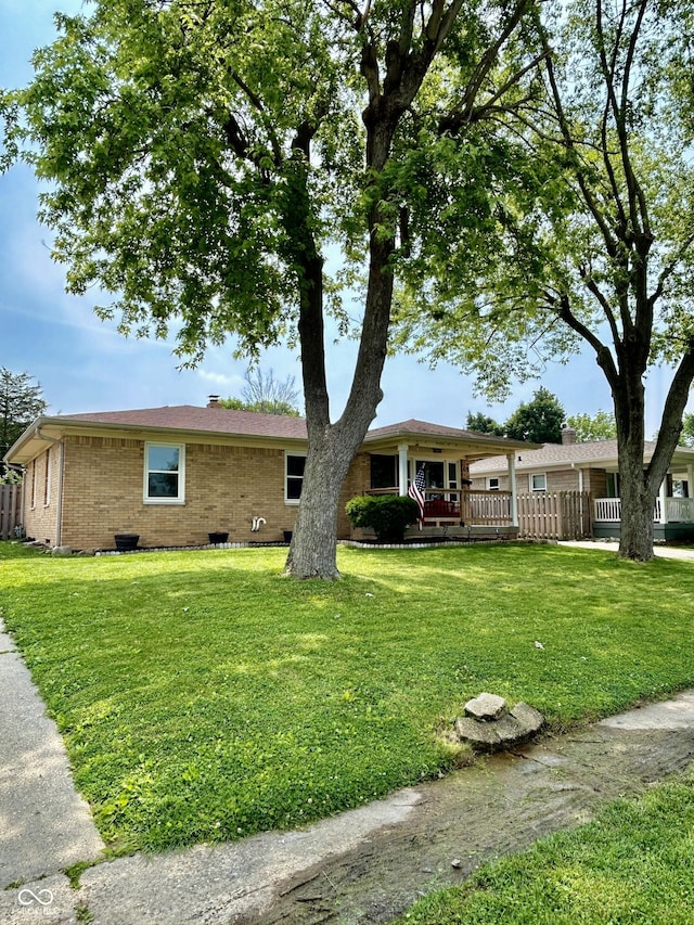 419 N 14th Ave, Beech Grove, IN 46107 - view of front of property with brick siding and a porch