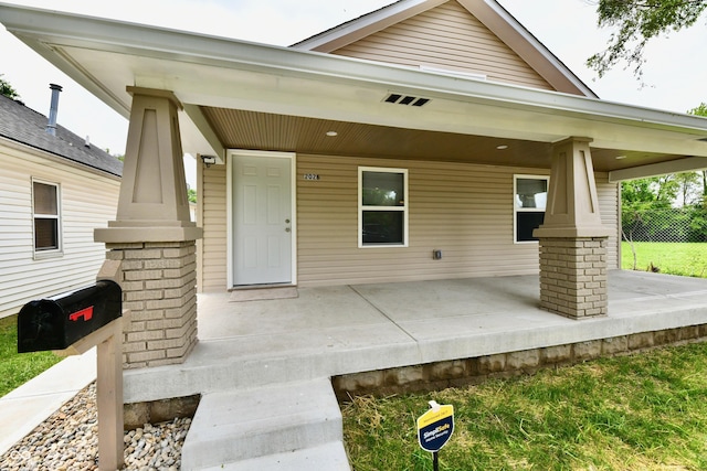 2026 Spruce St, Indianapolis, IN 46203 - view of exterior entry with covered porch