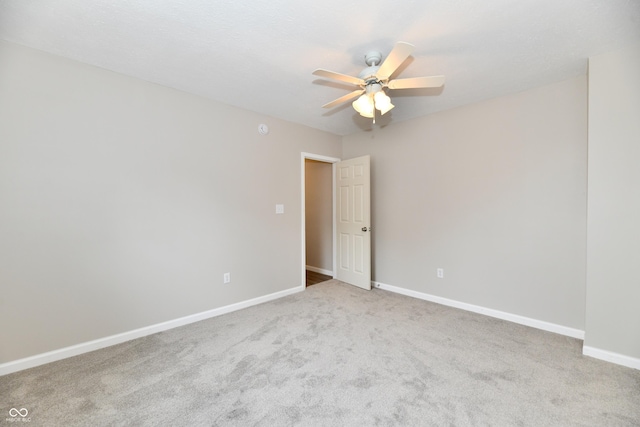 2026 Spruce St, Indianapolis, IN 46203 - empty room with a ceiling fan, carpet floors, and baseboards
