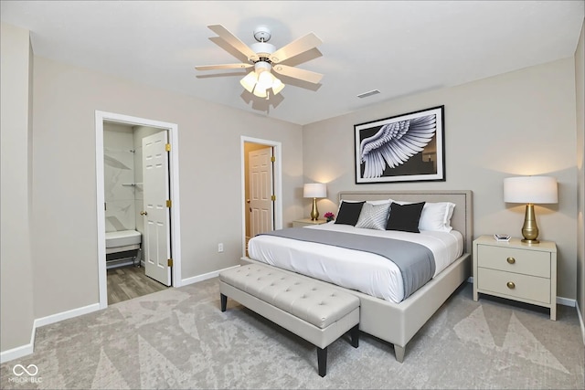 2026 Spruce St, Indianapolis, IN 46203 - bedroom with light carpet, baseboards, a ceiling fan, and ensuite bathroom