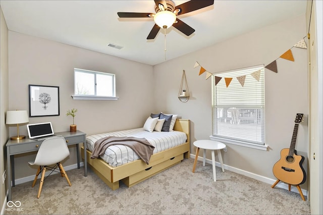 2026 Spruce St, Indianapolis, IN 46203 - carpeted bedroom with baseboards and ceiling fan