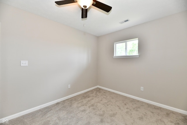 2026 Spruce St, Indianapolis, IN 46203 - carpeted empty room with baseboards and ceiling fan