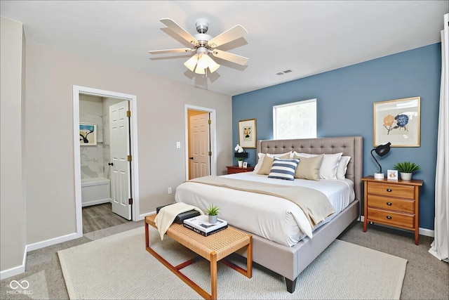 2026 Spruce St, Indianapolis, IN 46203 - bedroom with baseboards, carpet floors, ensuite bathroom, and a ceiling fan