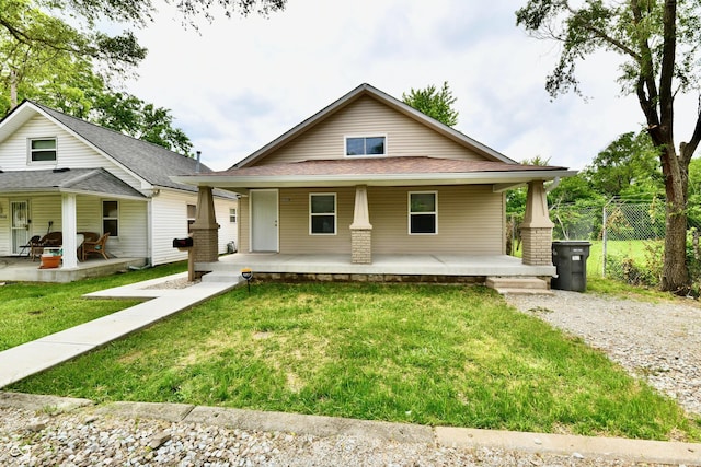2026 Spruce St, Indianapolis, IN 46203 - view of front of property with covered porch and a shingled roof