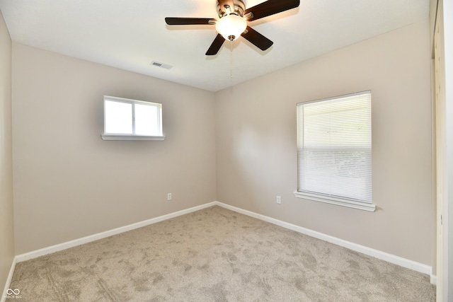 2026 Spruce St, Indianapolis, IN 46203 - carpeted spare room featuring baseboards and a ceiling fan