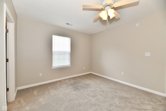 2026 Spruce St, Indianapolis, IN 46203 - carpeted empty room featuring baseboards, ceiling fan, and a smoke detector