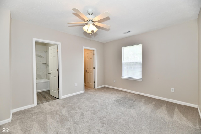 2026 Spruce St, Indianapolis, IN 46203 - unfurnished bedroom with carpet floors, baseboards, and ensuite bathroom