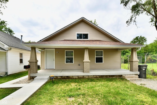 2026 Spruce St, Indianapolis, IN 46203 - view of front facade featuring covered porch and roof with shingles