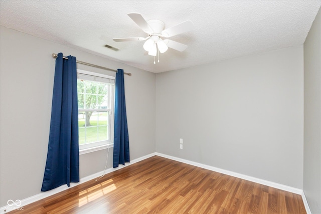 18005 Gasparilla Ct, Westfield, IN 46062 - empty room with wood finished floors, a textured ceiling, and ceiling fan