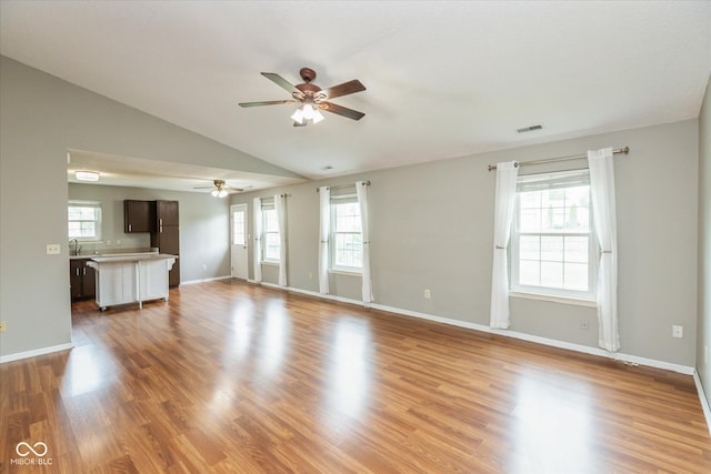 18005 Gasparilla Ct, Westfield, IN 46062 - unfurnished living room with a ceiling fan, lofted ceiling, and wood finished floors
