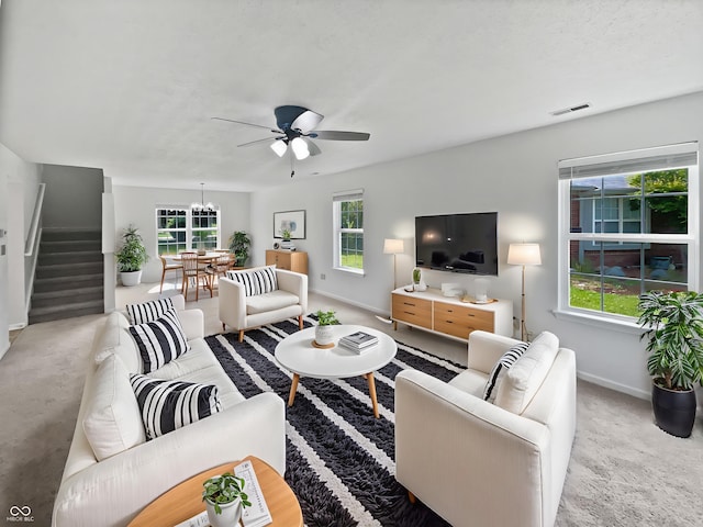 8437 Crosser Dr, Indianapolis, IN 46237 - living room featuring baseboards, a ceiling fan, plenty of natural light, and stairs