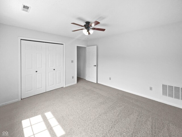 8437 Crosser Dr, Indianapolis, IN 46237 - unfurnished bedroom featuring carpet flooring, baseboards, a closet, and ceiling fan