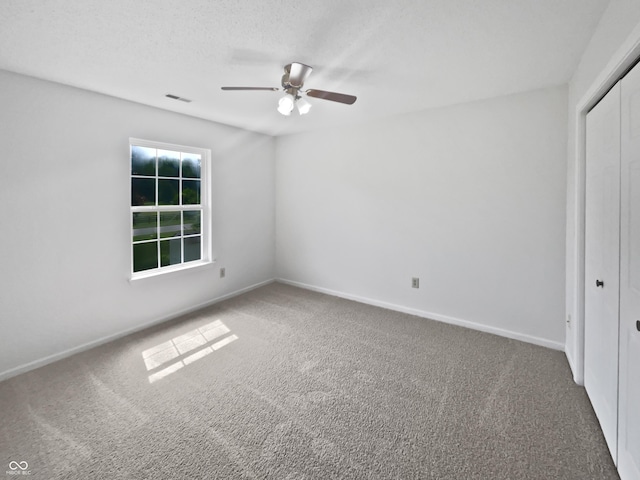 8437 Crosser Dr, Indianapolis, IN 46237 - unfurnished bedroom featuring carpet flooring, a closet, baseboards, and ceiling fan
