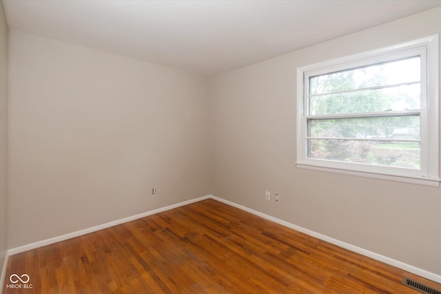 7223 Marla Dr, Indianapolis, IN 46256 - unfurnished room featuring baseboards and wood finished floors