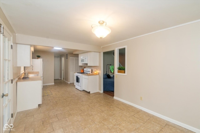 7223 Marla Dr, Indianapolis, IN 46256 - kitchen with white appliances, white cabinetry, light countertops, light stone finish flooring, and crown molding