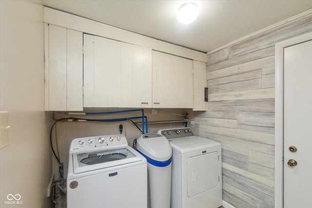 7223 Marla Dr, Indianapolis, IN 46256 - washroom with separate washer and dryer, cabinet space, and wooden walls