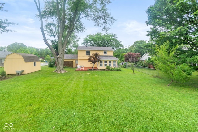 7223 Marla Dr, Indianapolis, IN 46256 - fenced backyard with a deck and a storage shed