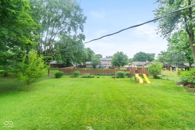 7223 Marla Dr, Indianapolis, IN 46256 - fenced backyard with a playground