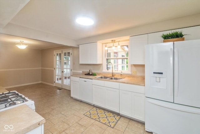 7223 Marla Dr, Indianapolis, IN 46256 - kitchen featuring white appliances, light countertops, white cabinetry, and french doors