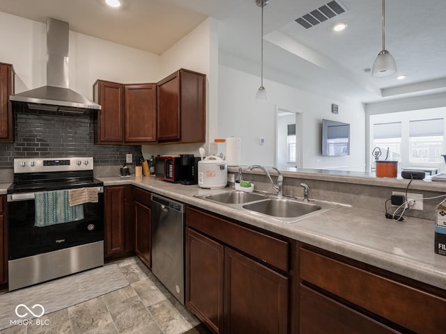 9001 Fitzgerald Dr, Indianapolis, IN 46239 - kitchen with stainless steel appliances, wall chimney exhaust hood, decorative backsplash, decorative light fixtures, and light countertops